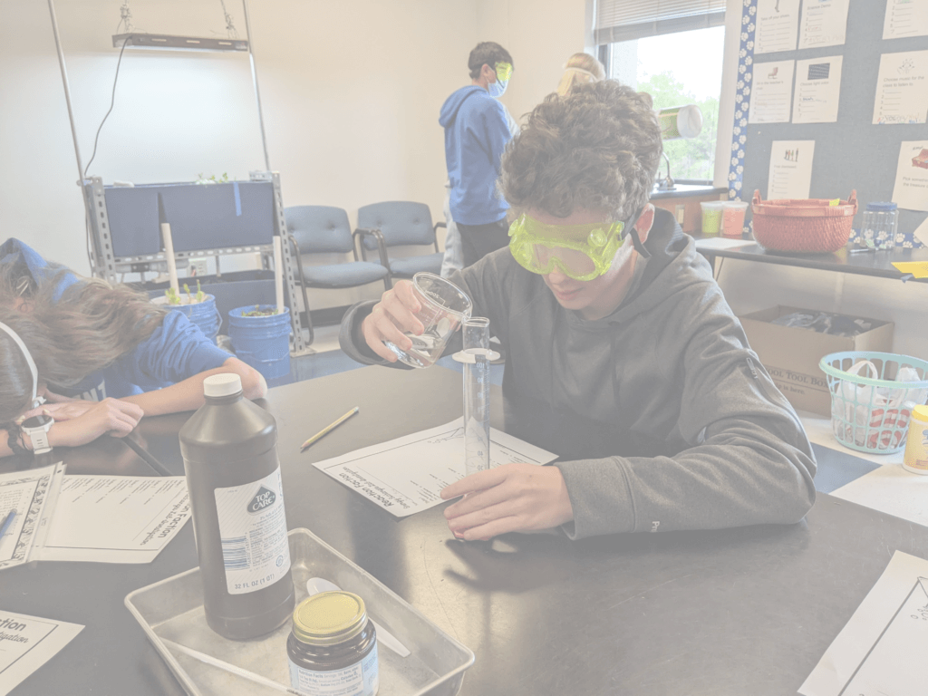 students doing a science experiment in class