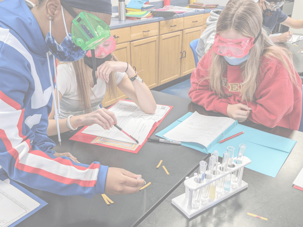 students doing a science experiment in class